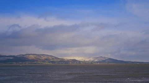 Winter beach scene with distant hills 스톡 동영상 124619728