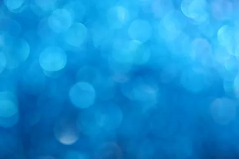Winter blue glitter light abstract blur background Stock Photos