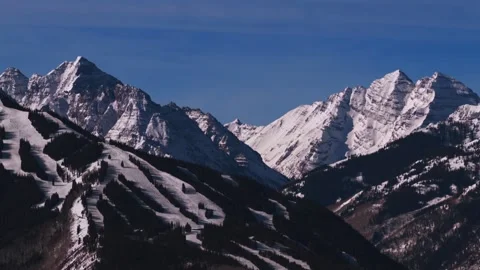 Winter bluebird Pyramid Peak Maroon Bells morning Aspen Mountain AJAX Aspen Stock-Footage 332379250