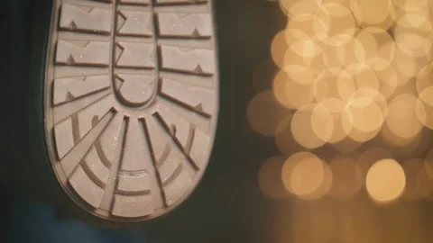 Winter Boot Sole Close Up Inspection, Textured Rubber Tread Pattern with Bokeh Stock Footage 299496381