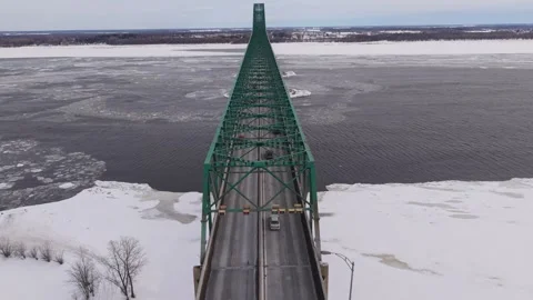 Winter bridge over icy river with isolated landscape Stock Footage 329395448