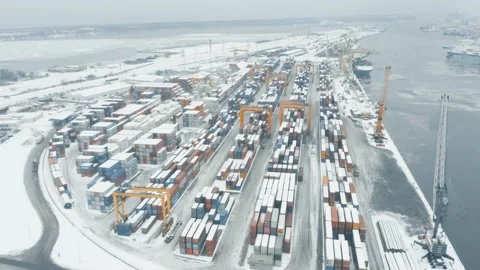 Winter busy container port loading and unloading cargo ships, aerial view Stock Footage 147681191