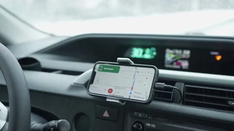 Winter Car Driving With Smartphone Google Maps GPS app Stock Footage 227028810