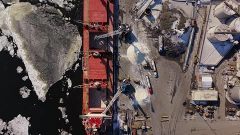 Winter cargo ship unloading in frozen port canada Stock Footage 329452364