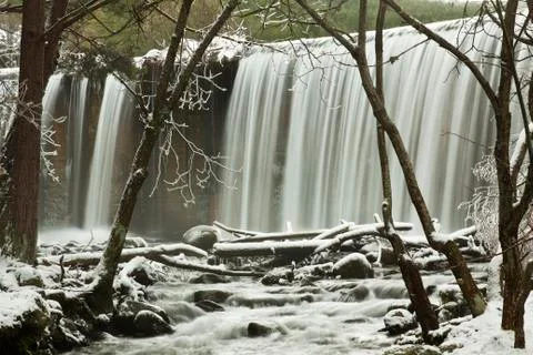 Winter cascade on forest Stock Photos