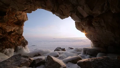 Winter. The cave in the rock is covered with ice. Lake Baikal Stock Footage 73766258