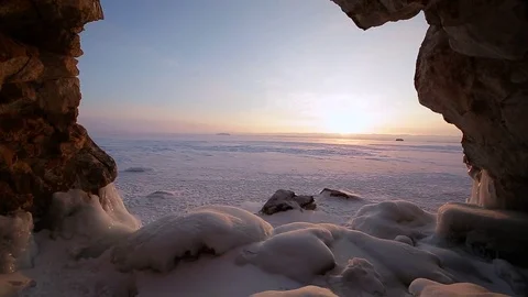 Winter. The cave in the rock is covered with ice. Lake Baikal 스톡 동영상 73766640