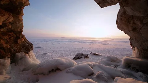 Winter. The cave in the rock is covered with ice. Lake Baikal Video stock 73767072