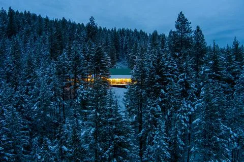 Winter Chalet at sunset Stock Photos