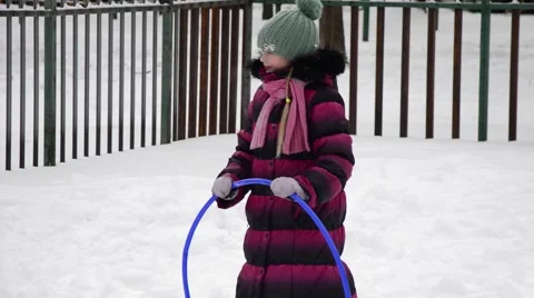 Winter Children sports program - boy and girl Running with rings Stock Footage 59115797