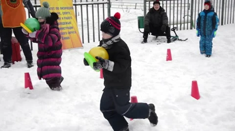 Winter Children sports program - running With The ball Stock Footage 59115433