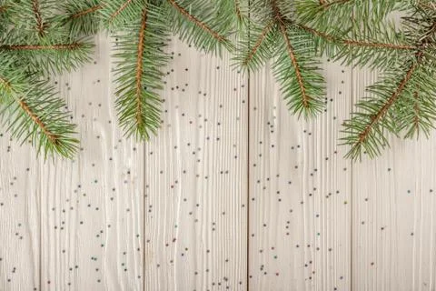 Winter Christmas pattern for Your design. Wooden background white. Spruce bra Stock Photos