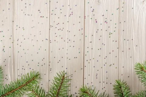 Winter Christmas pattern for Your design. Wooden background white. Spruce bra Stock Photos
