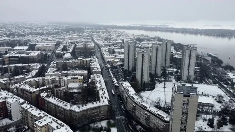 Winter cityscape, snow falling onto residential area Eastern Europe, New Stock Footage 295004489