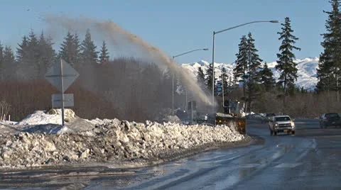 Winter Cleanup - Snow Blower on Sidewalk and Traffic 1 Stock Footage 10772907