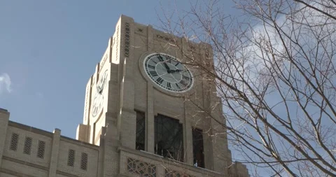 WINTER CLEAR SKY CLOCK TOWER IN THE CITY 4K Stock Footage 302487243
