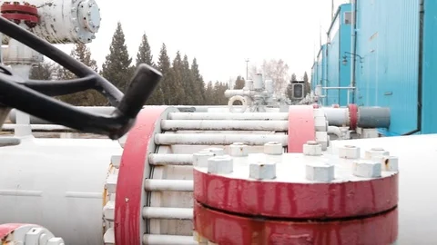 Winter closeup of white valve on pipe to shut off liquids, gas or air in Stock Footage 122067682