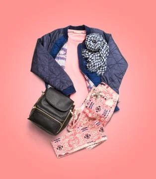 Winter clothes collection on pink gradient background Foto stock