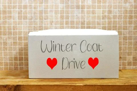 Winter Coat Donation Box Decorated with Hearts for a Clothing Drive Event Stock Photos
