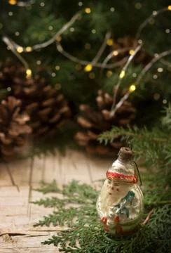 Winter composition with branches of juniper, thuja, garland and old New Year's Stock Photos