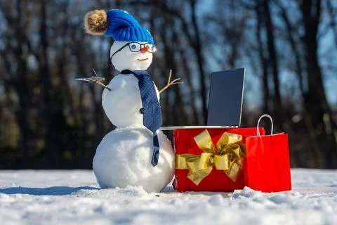 Winter Connection. Snowman Remote Work. Smart Snowman working Online. Winter Stock Photos