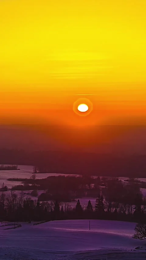 Winter Countryside Beneath Glowing Sunset Sky, Aerial Timelapse Stock Footage 336582105