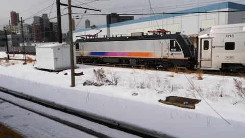 Winter day Amtrak commuter train moving from Right to Left Stock Footage 148456916