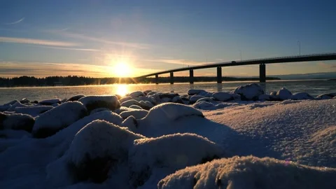 Winter day sun bridge car traffic fog over water ice and snow Video stock 147053587