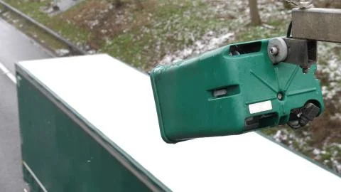 Winter day view average speed traffic camera under falling snow over UK Motorway Stock-Fotos