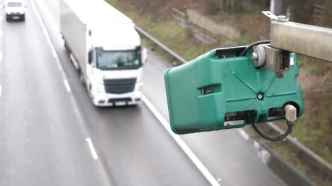 Winter day view average speed traffic camera under falling snow over UK Motorway Fotos de archivo