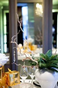 Winter decoration table using twigs, pine needles, gifts and gla Stock Photos