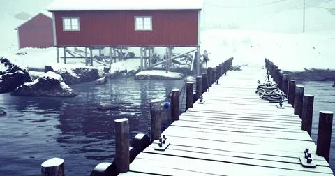 Winter dock view with red building and snowy landscape by the water Ilustración de archivo