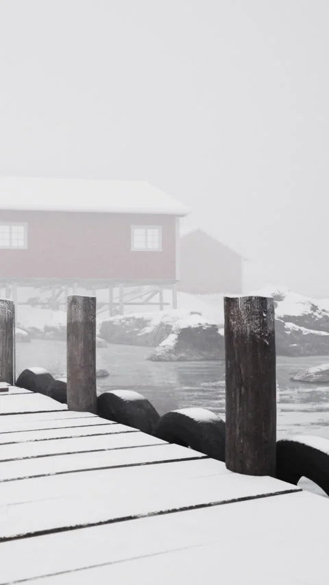 Winter dock view with red cabin along foggy water in Norway Stock Footage 338351032