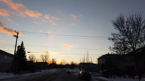 Winter Driving on Boulevard During Sunset Stock Footage 105470770