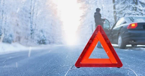 Winter Driving Cinemagraph - car breakdown on a mountain road - seamless loop Stock-Footage 99372874