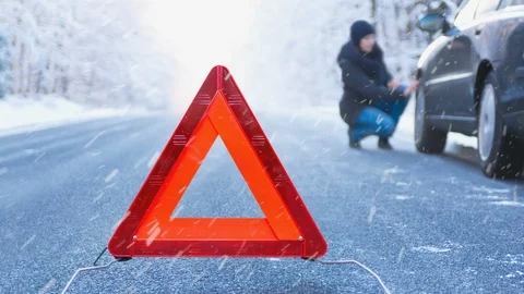 Winter Driving Cinemagraph - car breakdown on a mountain road - seamless loop Stock-Footage 99401479