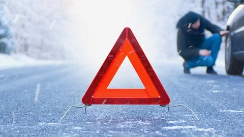 Winter Driving Cinemagraph - car breakdown on a mountain road - seamless loop Stock-Footage 99404661