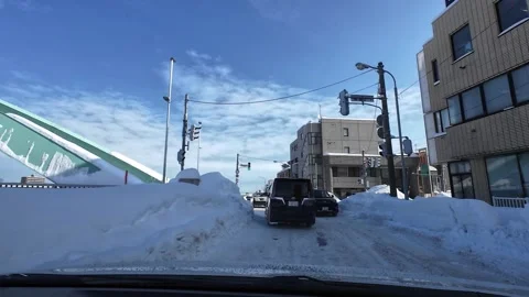 Winter driving intersection green light cars moving slippery road Video stock 333204756