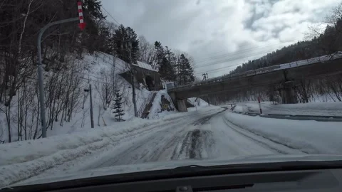 Winter Driving POV Under Bridge on Snowy Road Furano Hokkaido Japan Видео 333587662