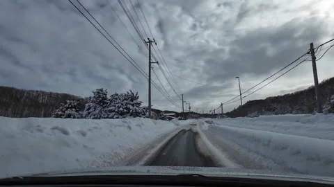 Winter driving rural road cloudy sky near Sapporo Japan Video stock 333204807