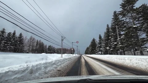 Winter driving toward Moai Statue Sapporo snowy road Hokkaido 스톡 동영상 333205053