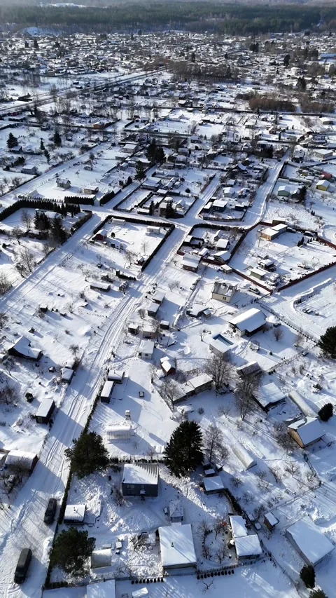 Winter Drone Flight Forward Over Snow-Covered Residential Neighborhood Stock Footage 339489957
