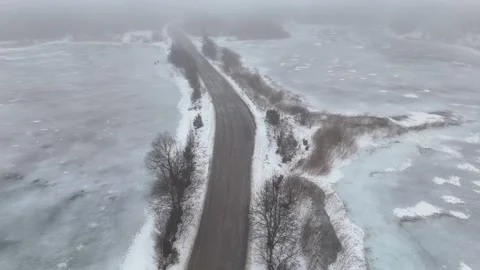 Winter Drone Flight Over Frozen lake With Ice Fishermen in Fog Stock Footage 340328827