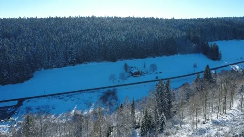 . Winter drone footage of forest edge and countryside under snow Stock Footage 325108344