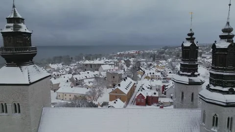Winter Drone Pass Between Visby Cathedral Towers Over Old Town Stock Footage 330028201