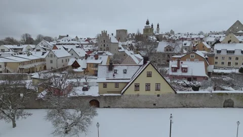 Winter Drone Tracking Along Visby City Wall from Almedalen Park Stock Footage 330031359
