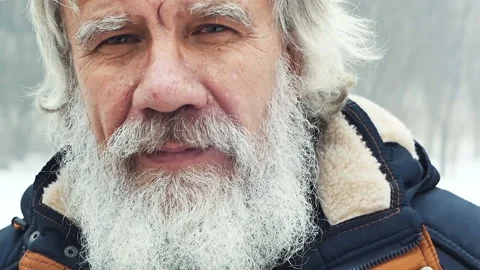 Winter. An elderly man with a beard laughs Stock Footage 85894999