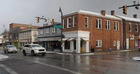 Winter Establishing Shot of Typical American Small Town Main Street and Snowfall Stock Footage 85644871