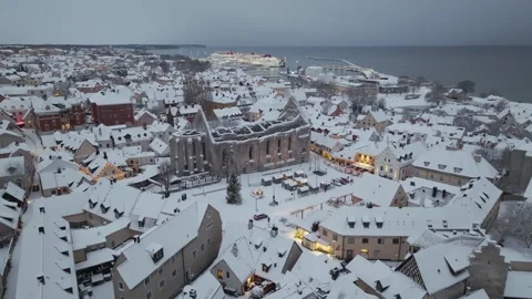 Winter Evening Drone Approach to Stora Torget and St Karin Ruin Visby Stock Footage 330025757