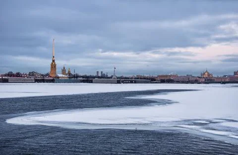 Winter evening view of the Peter and Paul Fortress from the Palace Bridge in Stock Photos